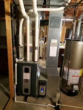 Outdoor AC condenser unit at a residential property in the Peoria area, the type of equipment serviced across the Tri-County Area